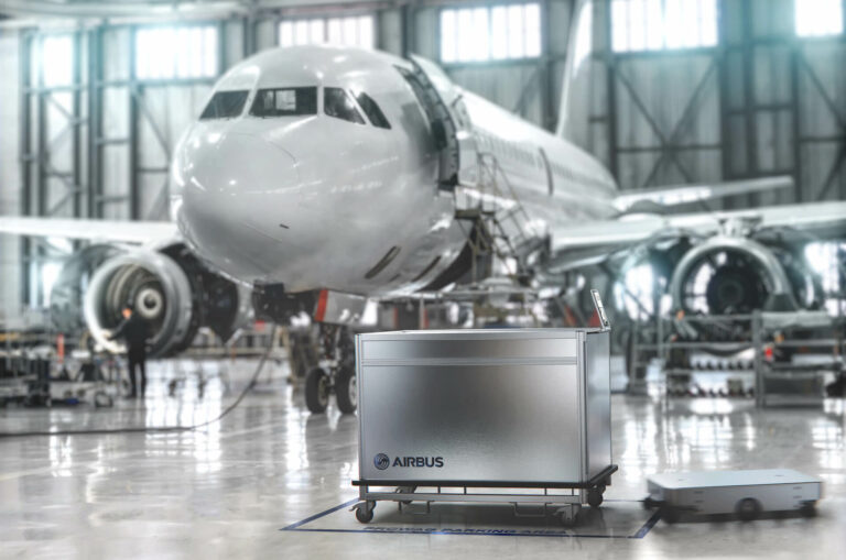 Photo of the Prowag in front of an airplane in a hangar